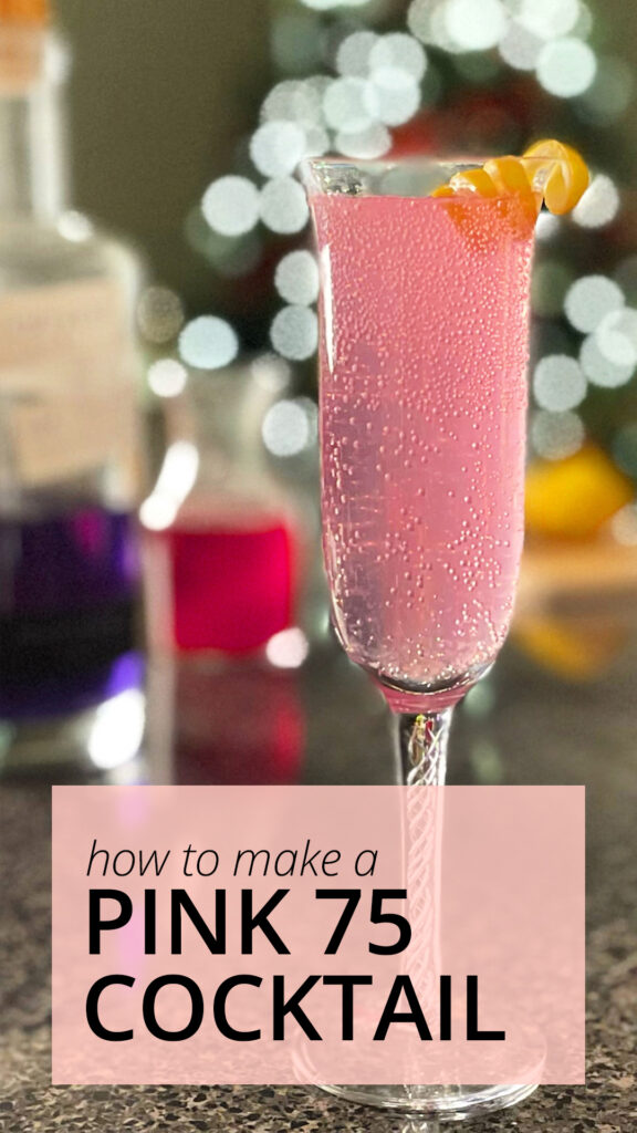 A photo of everything needed to put into a Pink 75 cocktail; champagne flute glass, cocktail shaker, measuring cups, lemon, Empress 1908 gin in the bottle, and a vial of red berry syurup.