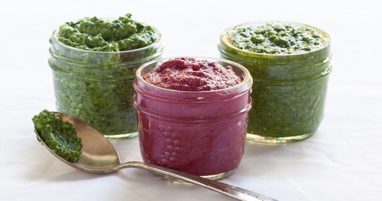 A photo of pink red beet pesto in a small mason jar.