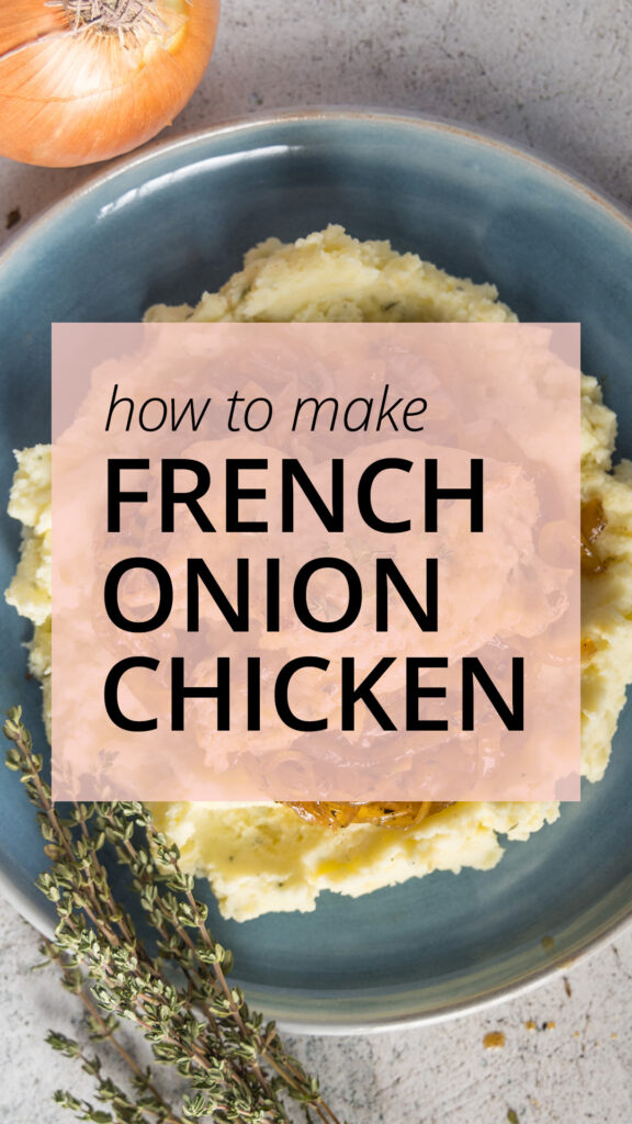 Chicken thighs, topped with melted Gruyère cheese, on top of caramelized onions, mashed potatoes, on a blue plate. Next to the plate is an onion and bunches of fresh thyme leaves.