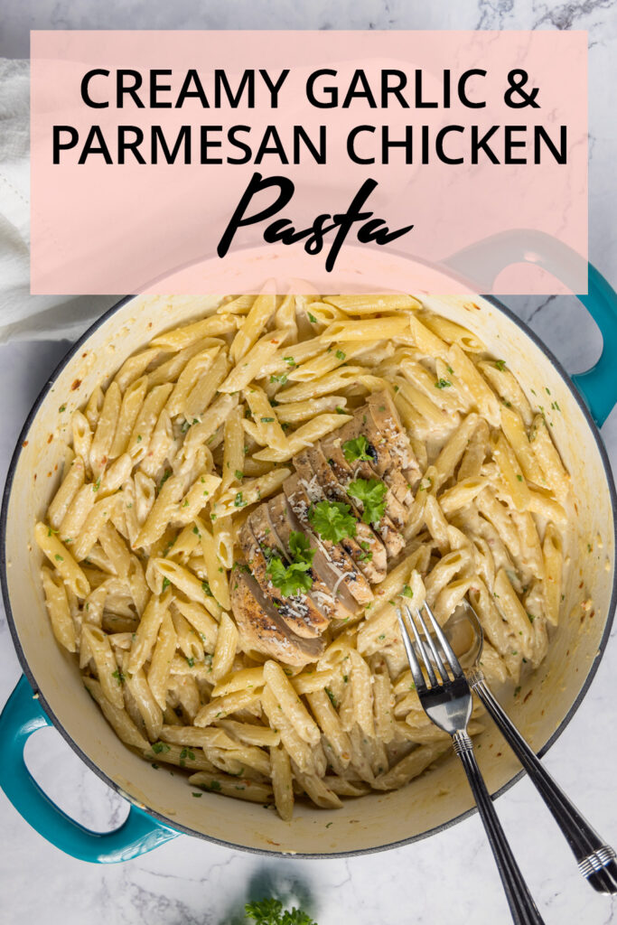 In a large 2-handled skillet, pasta with a creamy sauce, sliced grilled chicken, and garnished with fresh parsley and parmesan cheese.