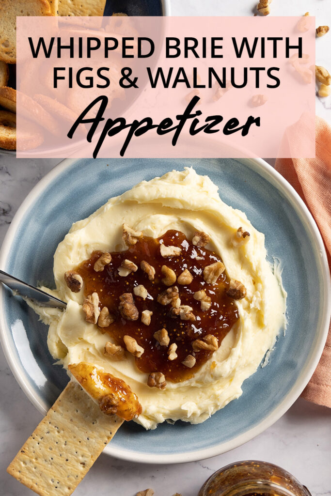 Whipped brie cheese in a bowl, topped with fig jam and chopped walnuts image for Pinterest