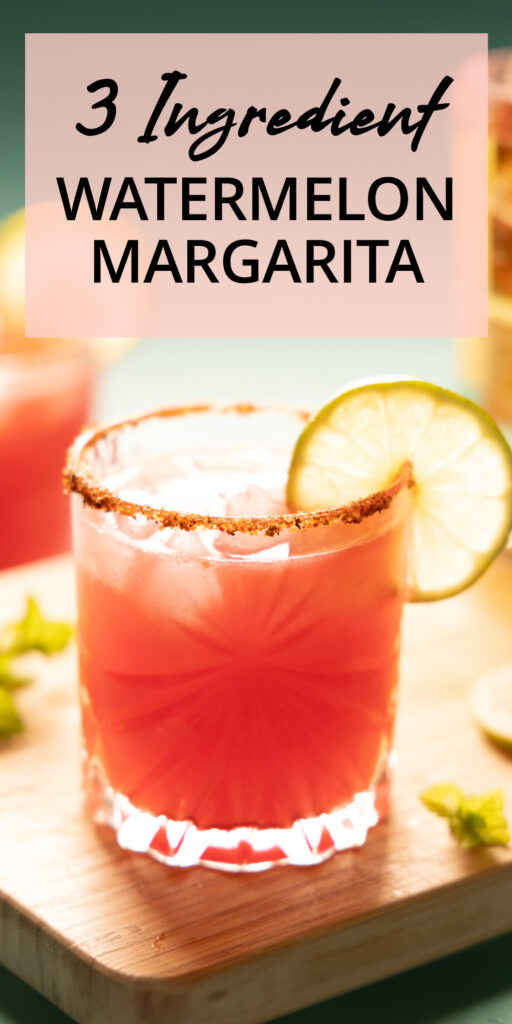 Pinterest image: Bright pink watermelon margarita on the rocks, with a lime wheel garnish.