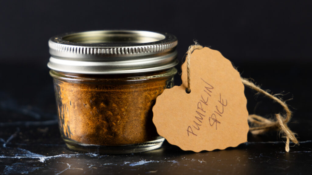 A jar of Homemade Pumpkin Spice with a hand-made label.
