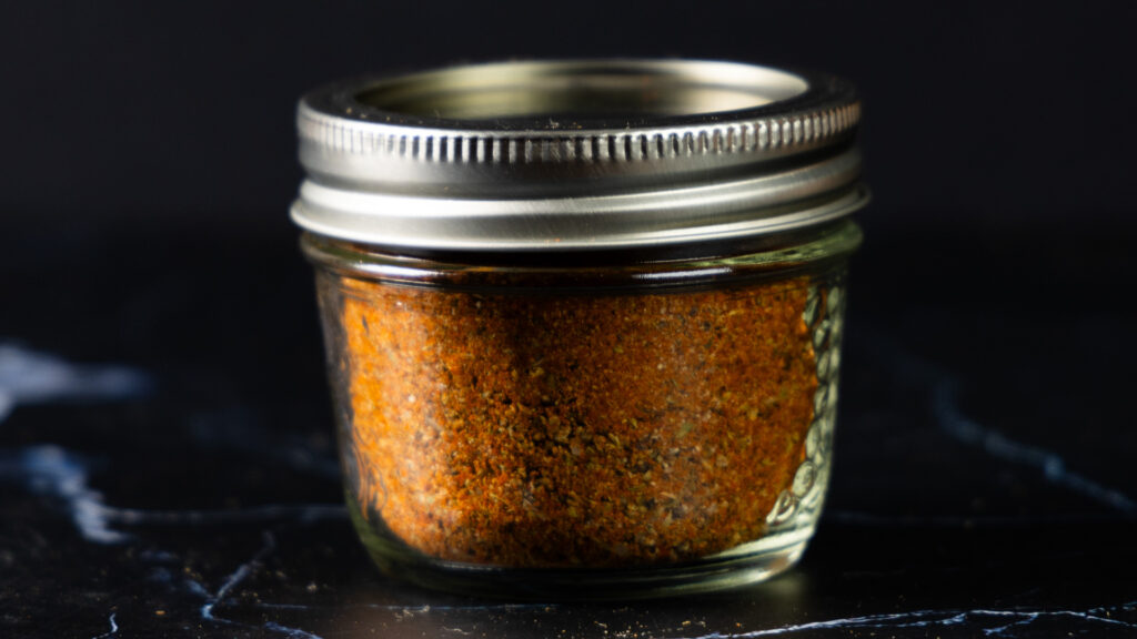 A jar of homemade Taco Seasoning.