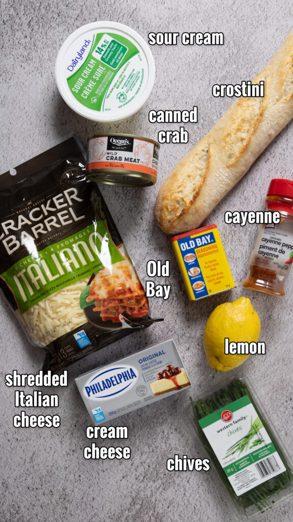 Ingredients to make Hot Crab Dip are arranged on a counter.