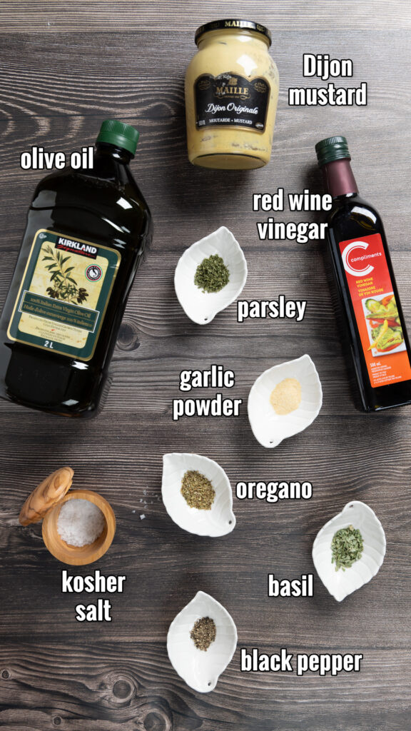 The ingredients for the Best Greek Dressing lined up on a counter.