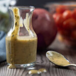 A carafe of homemade Greek dressing.