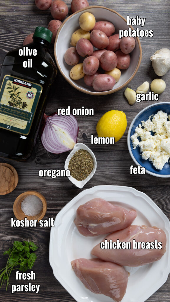 Ingredients for Sheet Pan Greek Chicken & Potatoes, arranged on a counter.