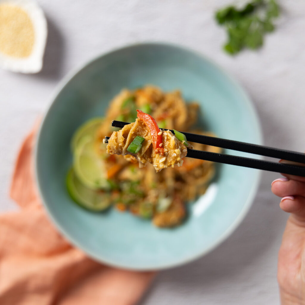 A bowl of spicy peanut chicken noodles