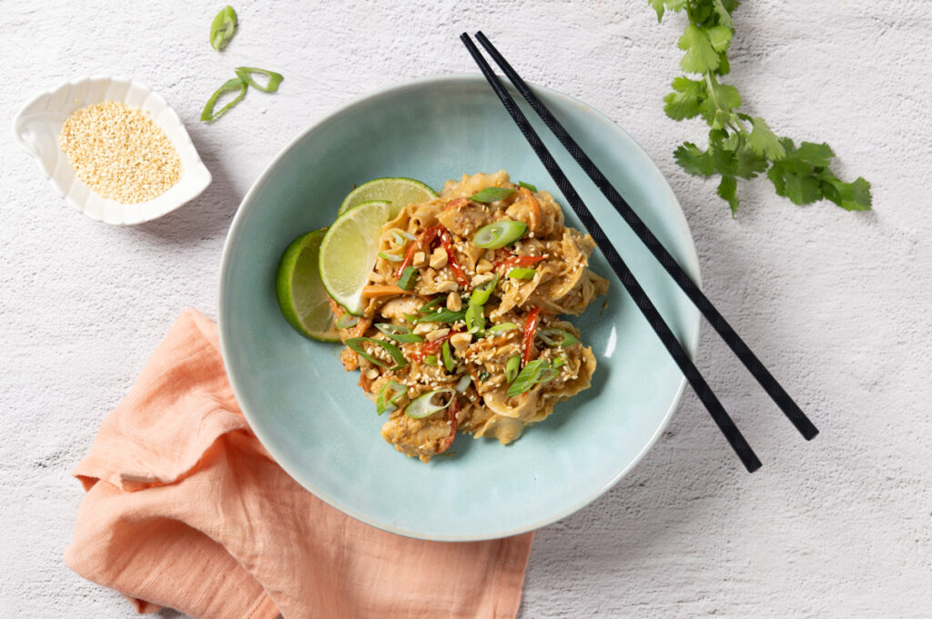 A bowl of spicy peanut chicken noodles