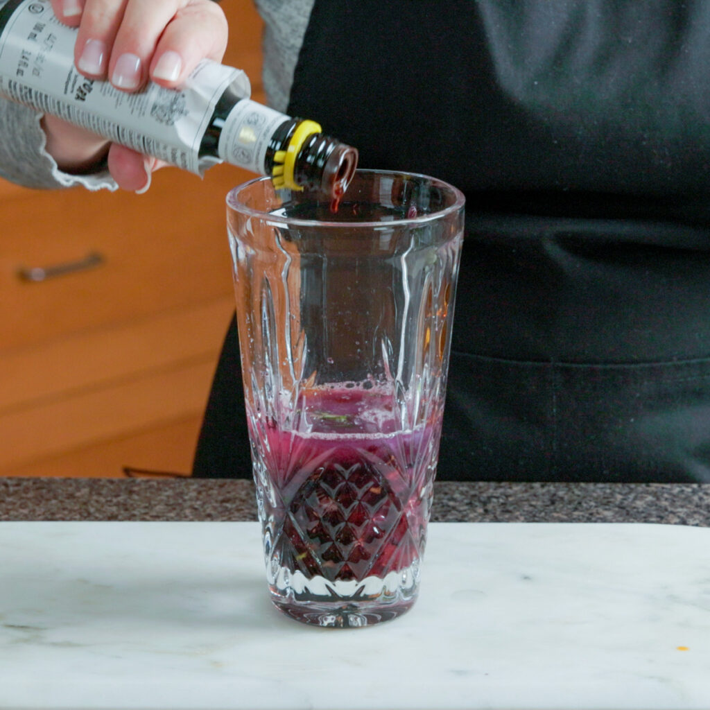 How to make a Blackberry Basil Sour: Add the rest of the ingredients to the shaker.