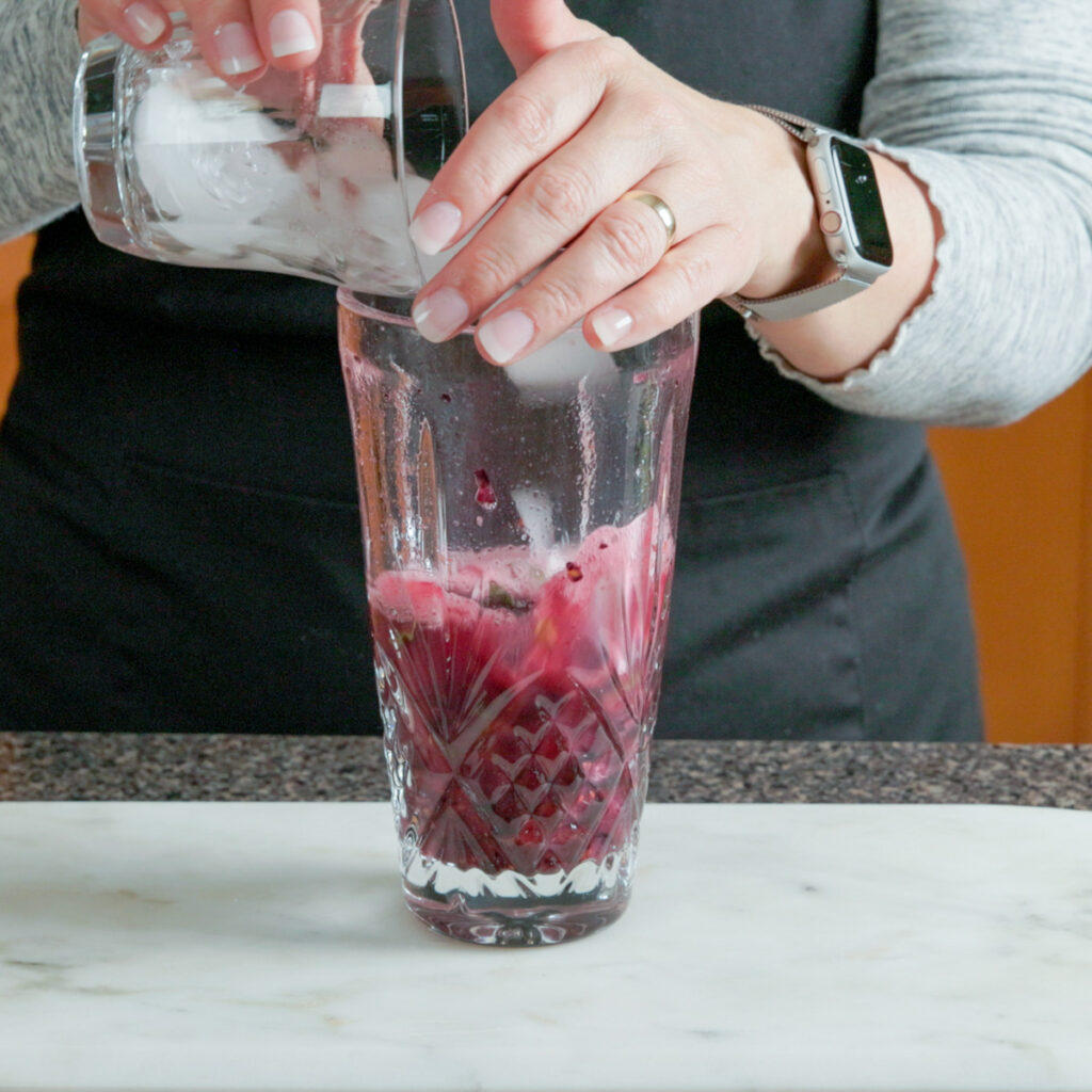 How to make a Blackberry Basil Sour: Add ice to the shaker.