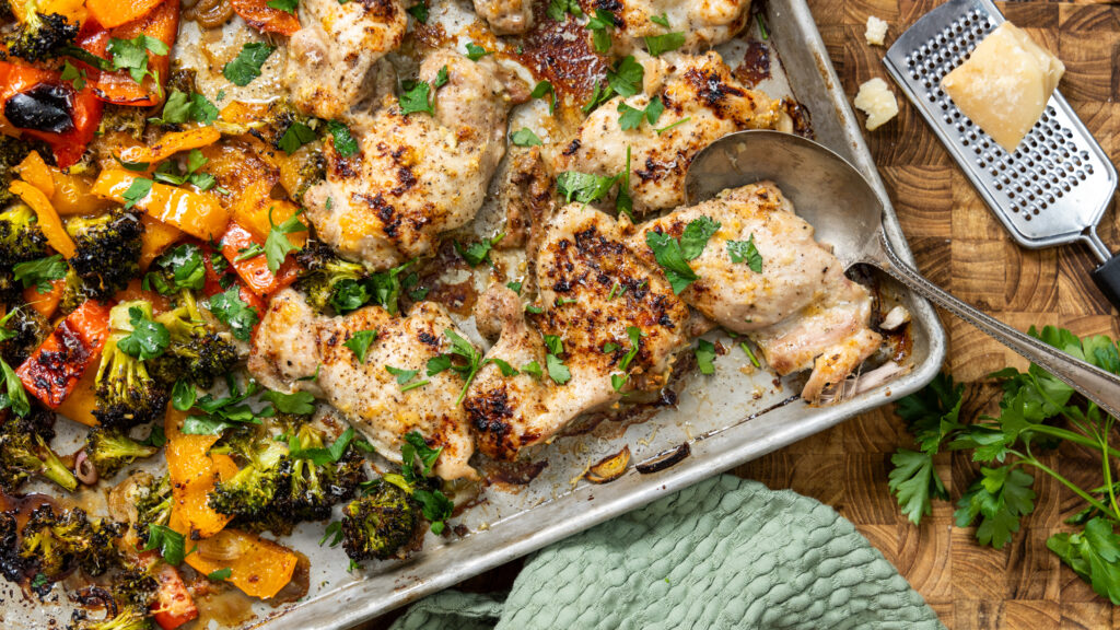 A sheet pan dinner with chicken and vegetables, flavoured with balsamic vinegar and parmesan.