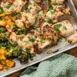 A sheet pan dinner with chicken and vegetables, flavoured with balsamic vinegar and parmesan.