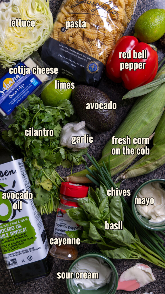 Ingredients for Street Corn Pasta Salad, arranged on a counter.