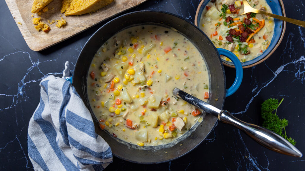 Chicken Corn Chowder in a soup pot and in a bowl