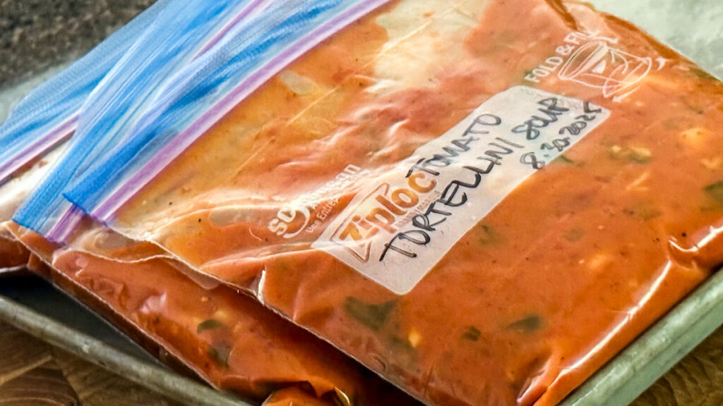 Ziiploc freezer storage bags filled with Tomato Tortellini Soup