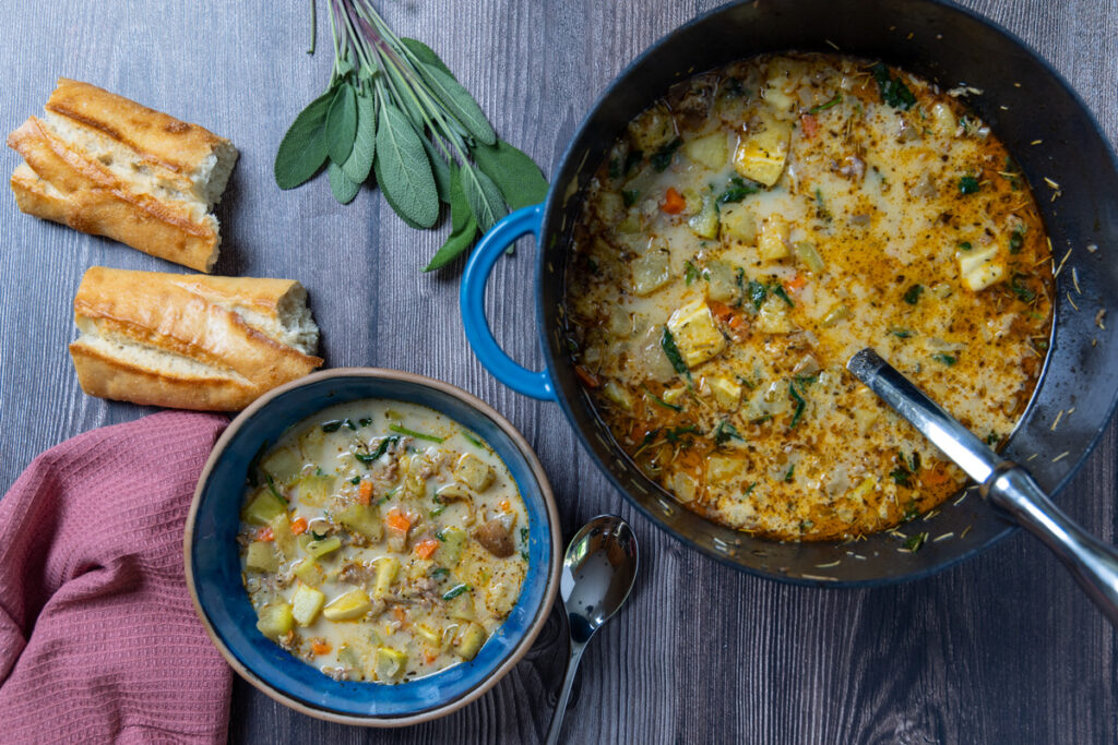 Rustic winter squash roasted with herbs and spices, combined with Italian sausage, potatoes, and spinach for a warm and cozy soup.
