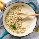 Creamy lemon parmesan beans in a skillet